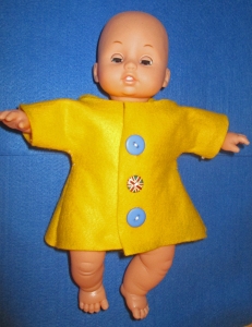 Doll wearing raincoat